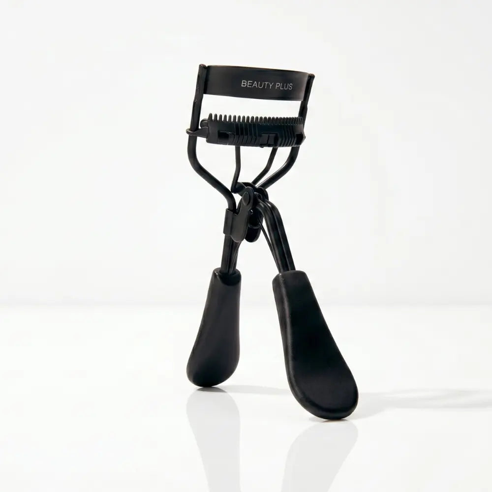 LIFT® Lash Curler by Beauty Plus in matte black with comb-style lash guide on a clean white background.